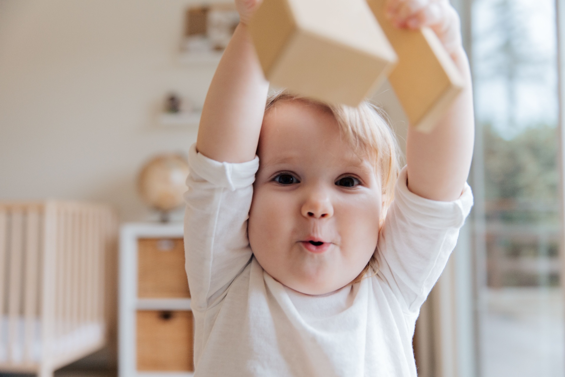 Toddler playing with wooden blocks